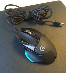 Logitech G502 and the velcro strap that can be wrapped around the cord.
