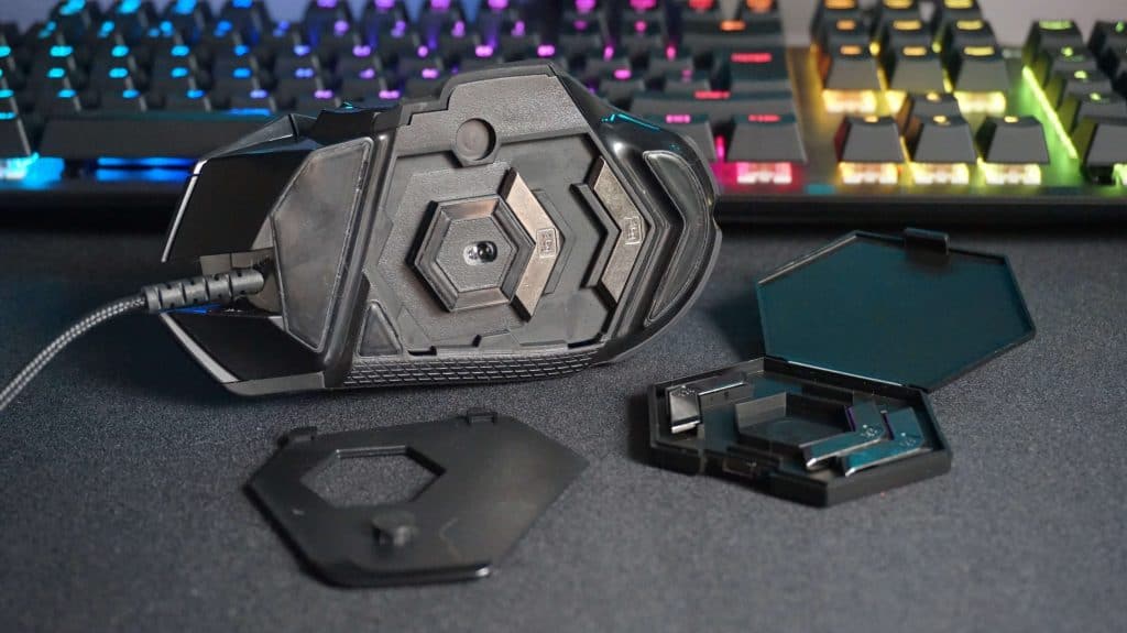 Logitech G502 HERO weights that can be added at the bottom.