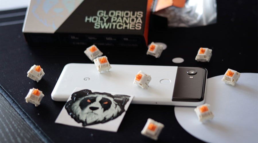 Picture of Gloarious Hola Panda switches when choosing the best keyboard for VALORANT.