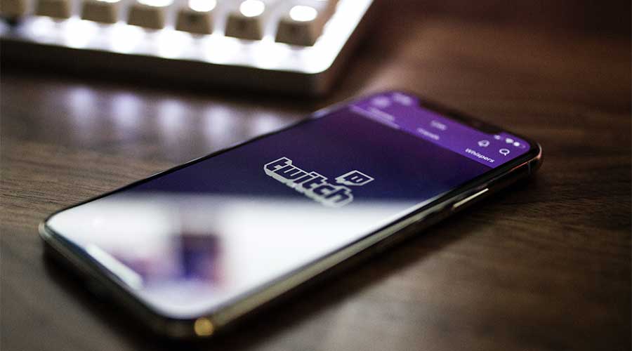 Picture of an iPhone with the Twitch.tv app on the screen.